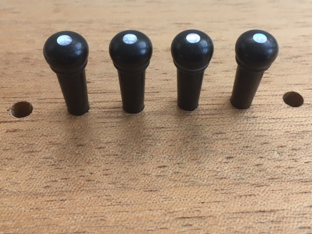 Tenor guitar, bridge pins, ebony, unslotted, pearl dot, 5 degree
